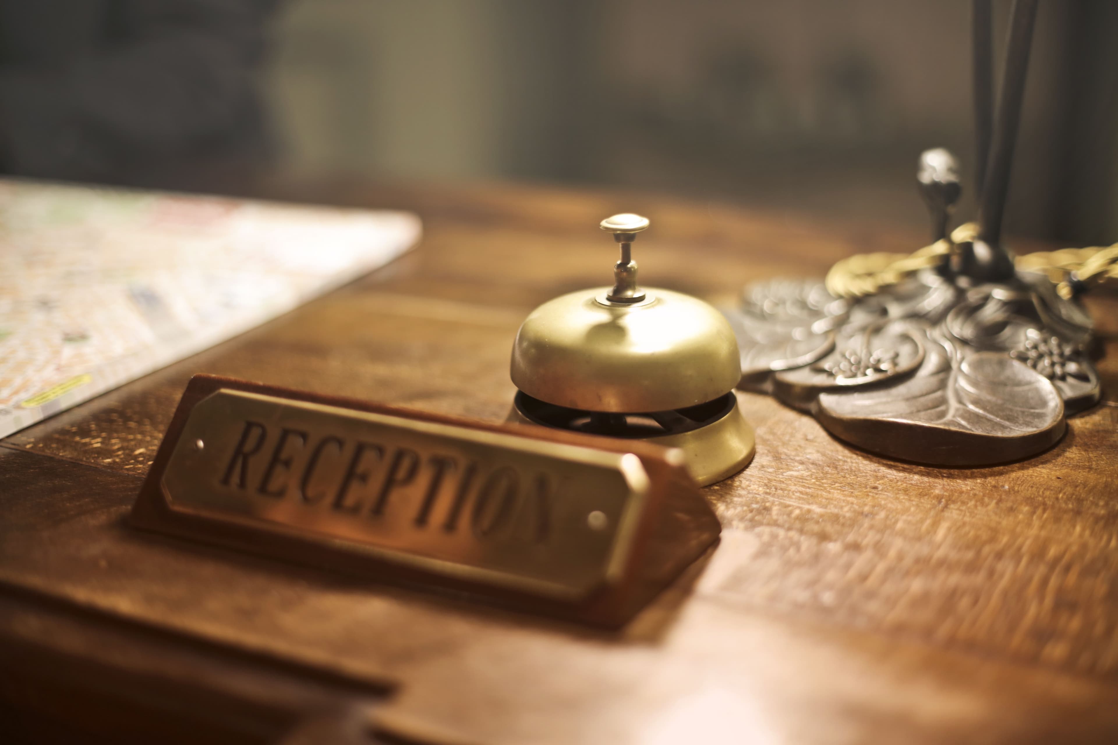 A reception desk with a service bell